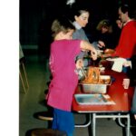 Devotion Primary Extended Day Program - Cathie with Parents at Pot-Luck Dinner