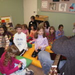 Devotion Primary Extended Day Program - John Walker Playing Giutar for Kids