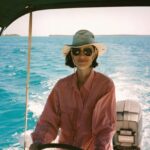 Travel - Cathie Steering the Boat in Belize Medium