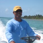 Travel - Cathie's Favorite Snorkel Guide Chris in His Devo Hat in Belize Large