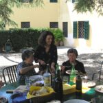 Travel - Collegalli -- Franca Burgisser and Daughter Serena and Franca's Sister Luciana Eating a Delicious Meal Prepared by the Women on the Colleagllie Patio Large